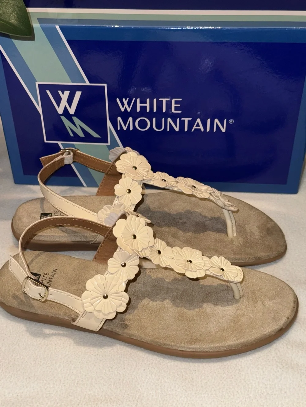 White Mountain Liftoff Flat Sandals feature delicate floral applique on T-strap